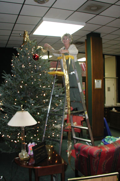 Martha trims the tree